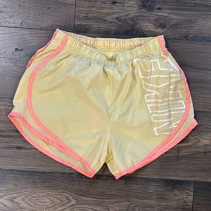 Yellow and pink Nike running shorts
